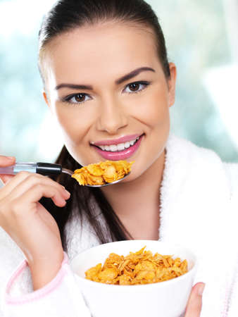 Portrait of beautiful woman, she eating cornflakes