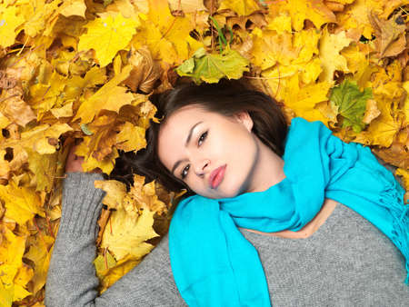 Beautiful woman spending time in park during autumn season