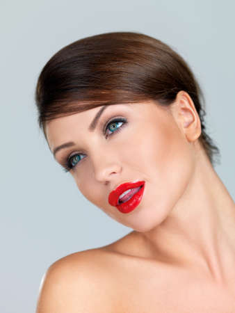 Portrait of beautiful woman, she is isolated on greyの写真素材