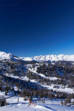Italian mountains over blue clear sky in winterの写真素材