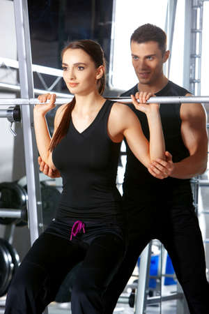 Sporty couple exercising at the fitness gymの写真素材