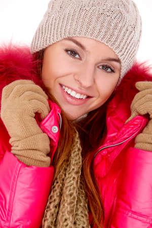 Cute young woman wearing winter jacket scarf and capの写真素材