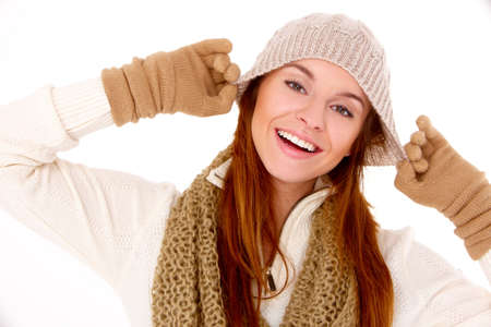 Young woman wearing warm winter clothes on whiteの写真素材