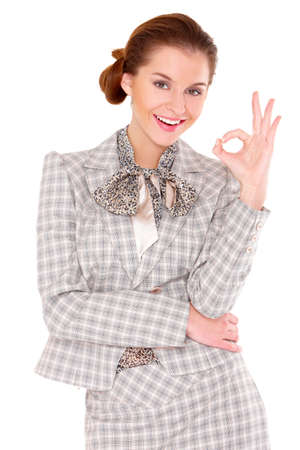 Portrait of a beautiful young business woman showing okay gestureの写真素材