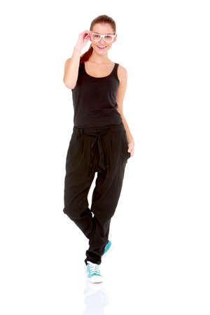 Fitness woman in black sports clothes isolated on whiteの写真素材