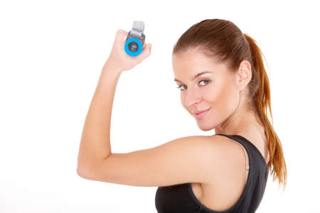 Fitness woman working out with dumbbells on whiteの写真素材