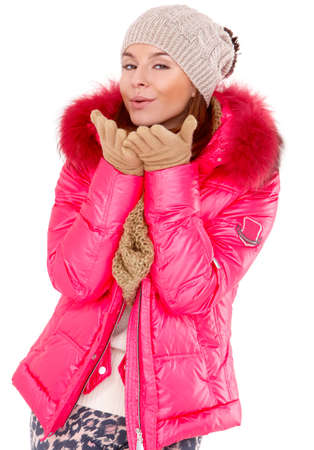 Pretty young woman wearing winter jacket scarf and capの写真素材