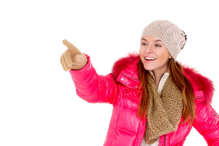 Happy young woman wearing winter jacket scarf and capの写真素材