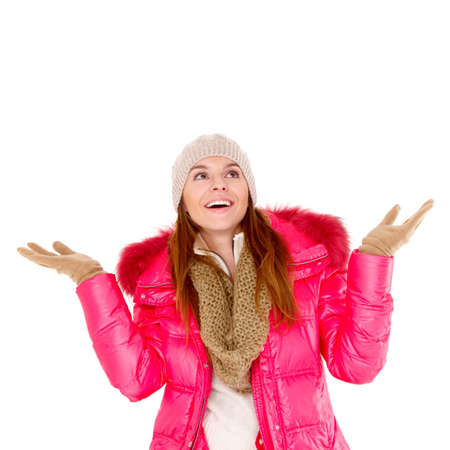 Adorable young woman wearing winter jacket scarf and capの写真素材