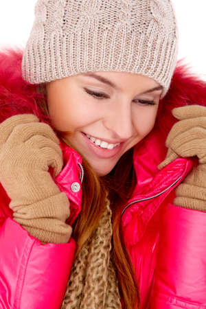 Pretty young woman wearing winter jacket scarf and capの写真素材