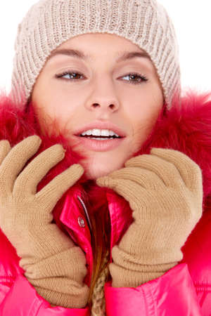 Pretty young woman wearing winter jacket scarf and capの写真素材