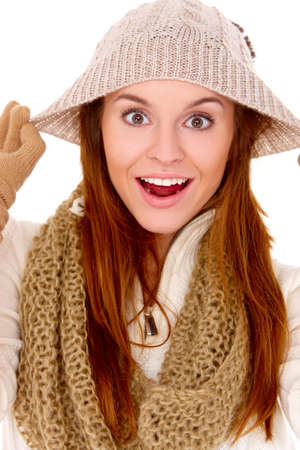 Young woman wearing warm winter clothes on whiteの写真素材