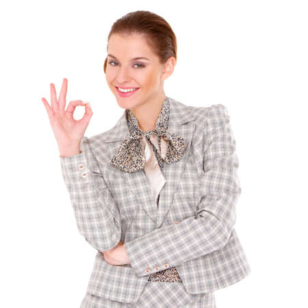 Portrait of a beautiful young business woman showing okay gestureの写真素材