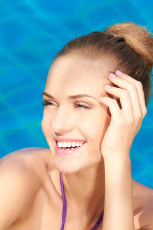 Close up of young adorable woman in swimming poolの写真素材