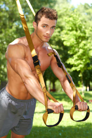 Handsome man doing outdoor exercisesの写真素材