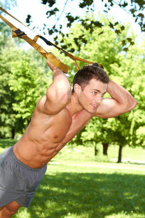Handsome man doing outdoor exercisesの写真素材