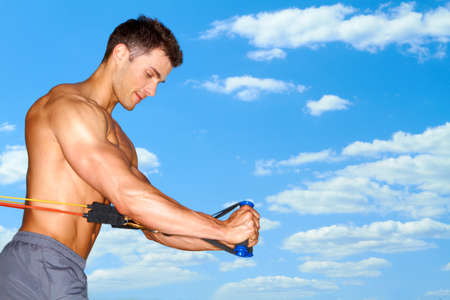Handsome man doing outdoor exercisesの写真素材