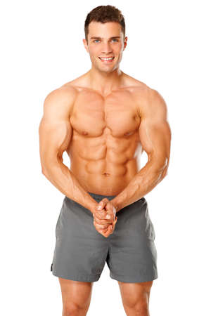 Sporty and healthy muscular man isolated on white backgroundの写真素材