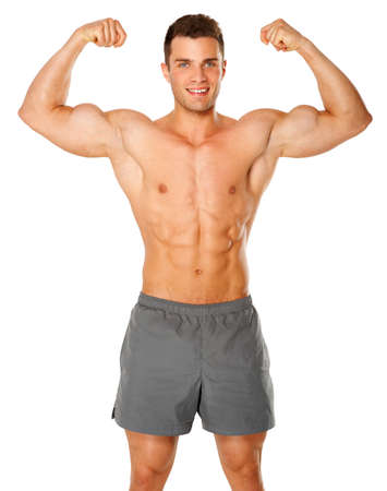 Fit and muscular man flexing his biceps on white backgroundの写真素材