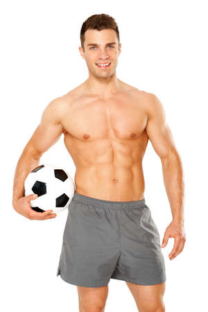 Sporty man holding foot ball on white backgroundの写真素材