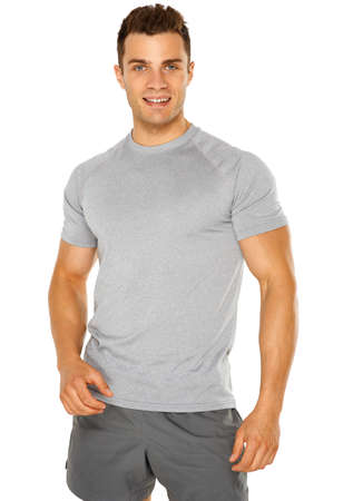Healthy muscular young man isolated on white backgroundの写真素材