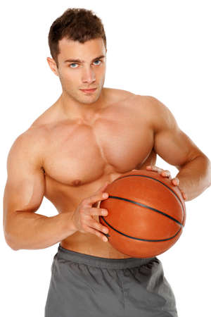 Portrait of a young man holding the ball tightly against white backgroundの写真素材