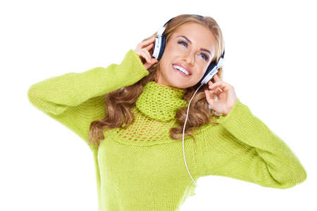 Woman with headphones listen to music on whiteの写真素材
