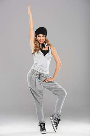 Female modern dancer posing on grey backgroundの写真素材