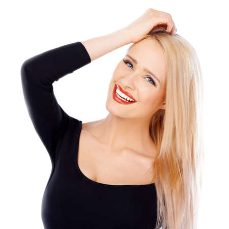 Cute blond girl with red lipstick on her lips posing while isolated on white backgroundの写真素材