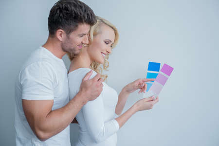 Happy Couple Looking at Color Indicator Paperの写真素材