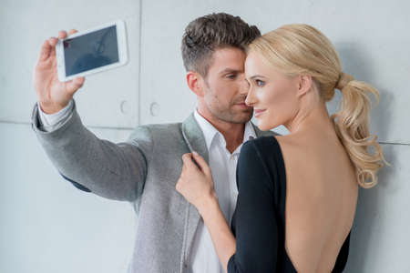 Young Romantic Couple Taking Sweet Photosの写真素材