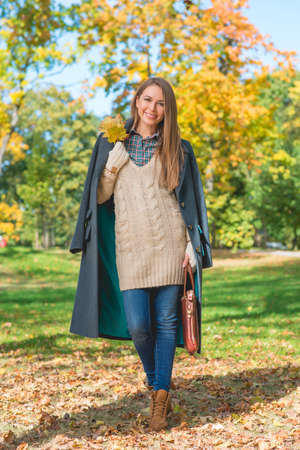 Smiling Woman on Nature Background During Autumn