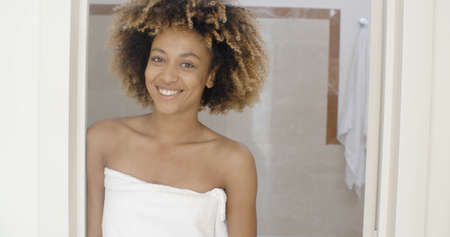 Portrait of a female smiling at a bathroomの写真素材