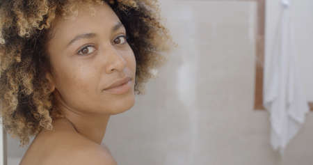 Young woman after bath smiling in the cameraの写真素材