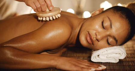 Portrait of young beautiful african-american woman in spa environmentの写真素材