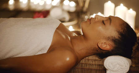 Portrait of young african american woman in spa environmentの写真素材