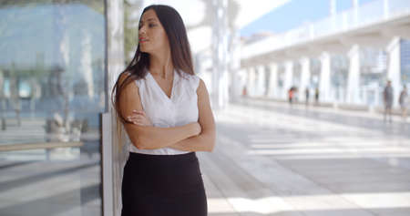 Beautiful and Sophisticated Business Woman Standing on Malaga Harbour Promenadeの写真素材