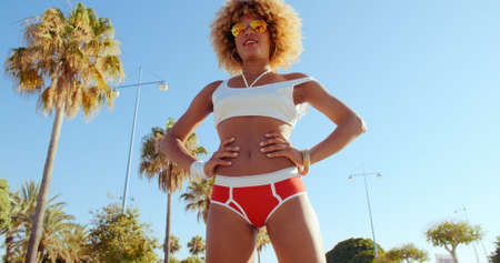 Retro Stylized Sexy Afro American Girl Standing With Hands on Hips. She Wearing Red Panties  Shirt...