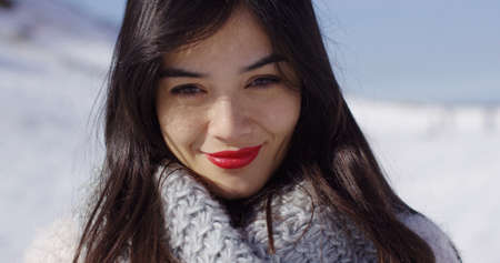 Beautiful young woman in snowy landscapeの写真素材