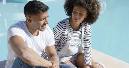 Attractive African couple chatting in the sun