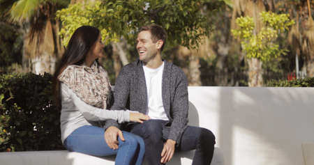 Affectionate young couple enjoying a quiet chat