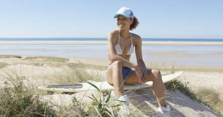Happy female on a surfboardの写真素材