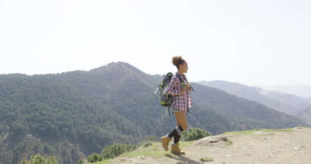Female traveler backpacking in summerの写真素材