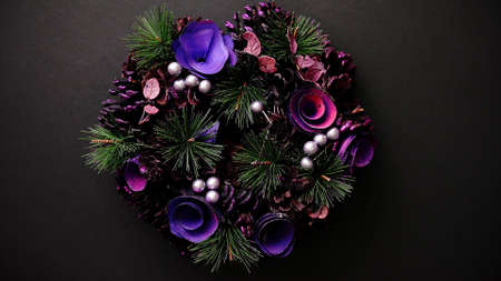 Christmas Wreath on black Background, Top View, Flat Lay, Winter Holidays Concept.の写真素材