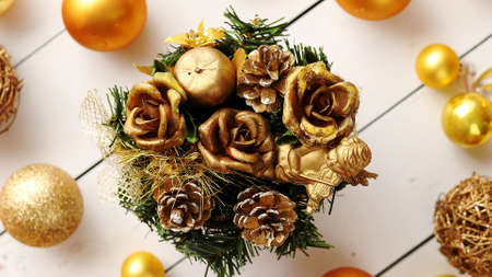 Christmas golden collection, pine tree, balls and decorative ornaments, on white wooden background.の写真素材