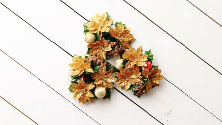 Christmas Wreath on White Wooden Background, Top View, Flat Lay, Winter Holidays Concept.