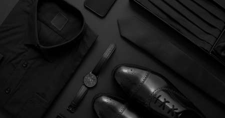 Elegant man clothes concept. Set of black wardobe and accessories for official party evening meetingの写真素材