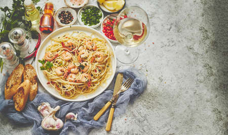 Seafood concept. Pasta with shrimps in a plate, close-up, copy space, top view, flat lay. Pasta...
