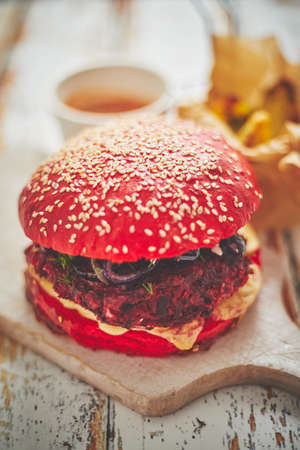 Beetroot burger on shabby tableの写真素材