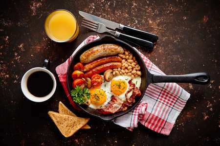 Delicious english breakfast in iron cooking panの写真素材